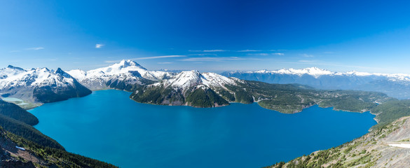 Panoramic wide scenery from Panorama Ridge peak with view over whole Garibaldi lake and surrounding...