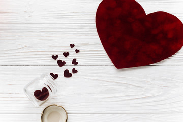 valentine concept. stylish velvet heart and glass jar on white w