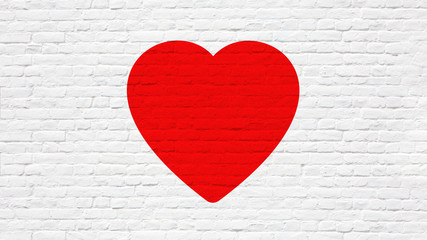 Coeur rouge sur mur de briques