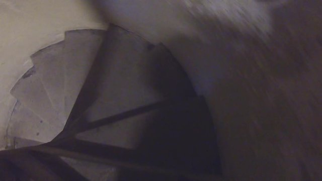 Elliptical medieval stone staircase in old castle