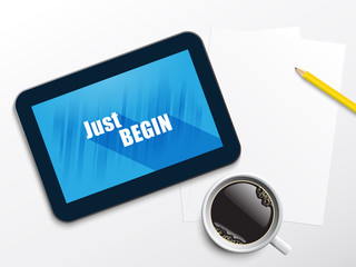 Fototapeta premium JUST BEGIN motivational quote on tablet