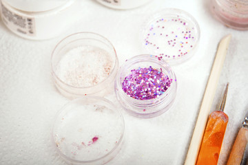 Manicure in beauty shop. Gel nails. Master make nail extension. Gel nail polish jar bottle closeup