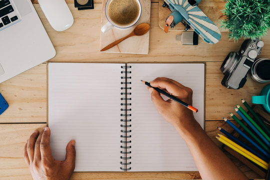 Hero Header Creativity Concept. Top view of man writing notebook with designer's accessories, Craetive items.