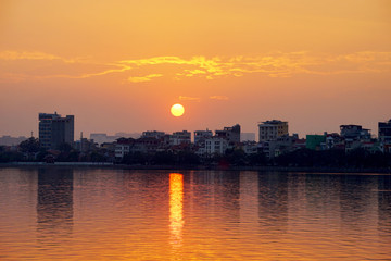 Fototapeta na wymiar Sunset on West lake (Ho Tay), Hanoi, Vietnam