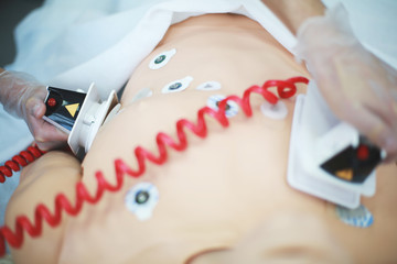 Application Defibrillator on CPR training - obrazy, fototapety, plakaty