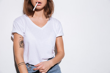 Cropped photo of attractive woman with cigarette.