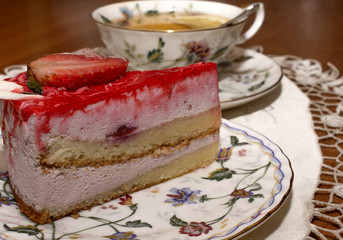 a piece of strawberry pie and a cup of tea