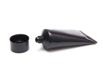 Skincare in black plastic tube isolated on white background