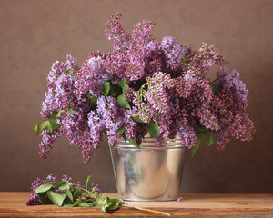 Bouquet of lilac in a bucket.