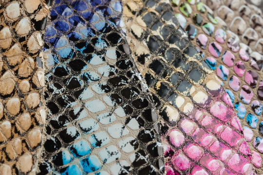 Colored samples of Genuine leather in a different colors. Texture close-up, embossed under the skin reptile