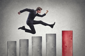 Businessman jumping to the top 