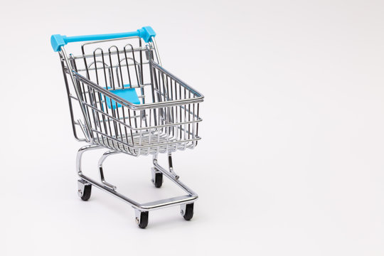 Shopping trolley on the white desk