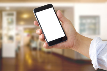 Man using smartphone at living room blur background.