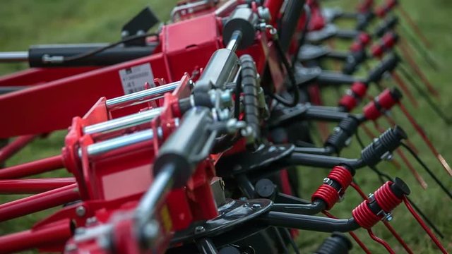 We can see many rakes on the machinery which a farmer will use for turning hay around.
