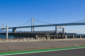 Fototapeta na wymiar Pier Fourteen and Oakland Bridge