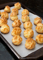 French dessert croquembouche. Wedding cake. New year dessert. Homemade eclairs filled with custard. Profiterole. 