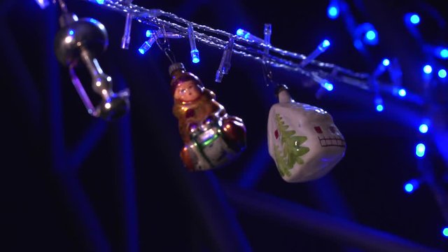 Christmas tree decorated with antique toys and garlands.