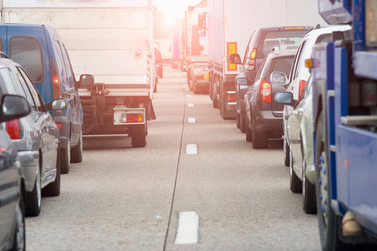 Rear view of rows of traffic queueing on highway