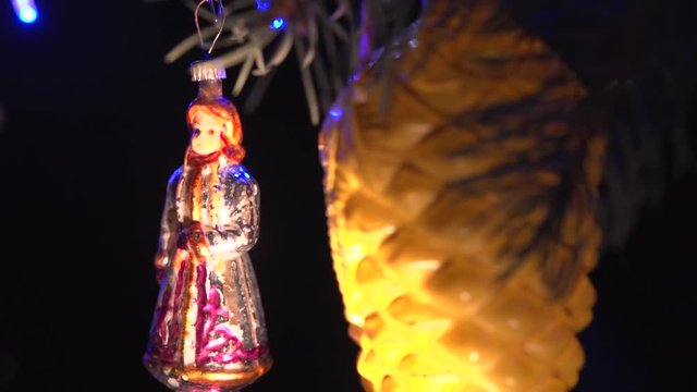 Christmas tree decorated with antique toys and garlands.