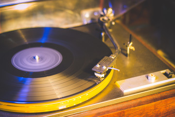 Close up at vintage gramophone. playing old song,Vintage record player with vinyl disc