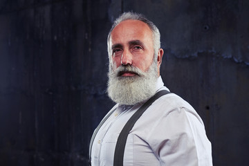 Serious gaze of mature man looking directly at the camera isolat