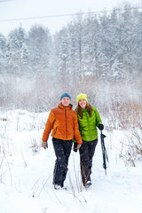 Fototapeta na wymiar Active family walking in the winter forest.