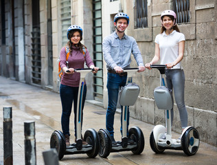 Adult friends posing on segways in vacation