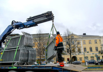 Man working with a truck crane