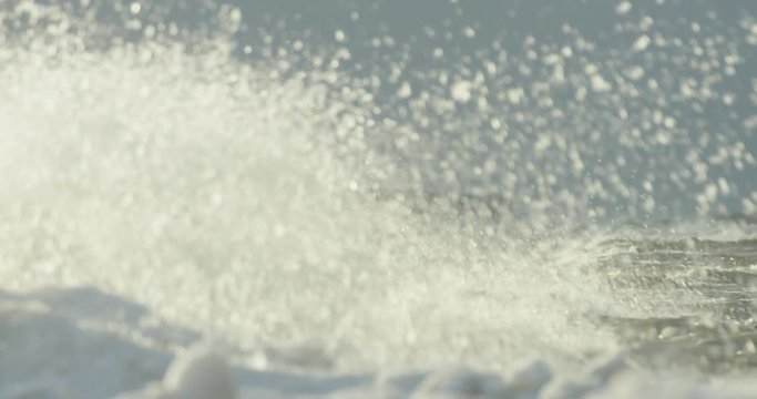Slow motion of waves crushing frozen shore during a winter storm in the Baltic Sea, RED Dragon 4K 120fps
