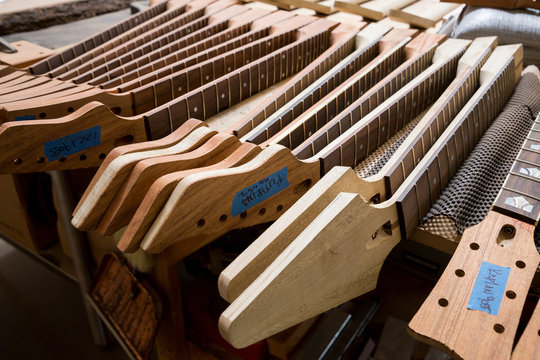 Headstocks and necks of guitars in workshop