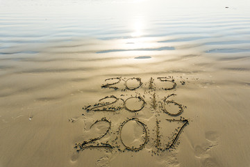 Numbers 2017 on beach wave, Newyear concept
