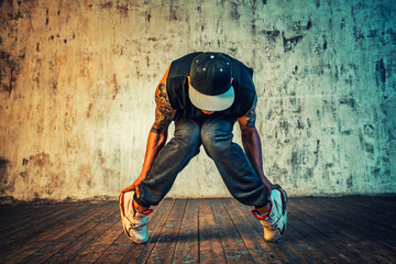 Man dancing on wall background