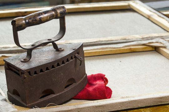 Antique cast-iron iron on the subframe