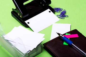 stationery for office: hole puncher, clips, blanks, wallet, pen, stickers