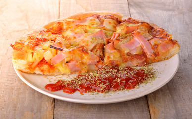 hawaiian pizza on table background