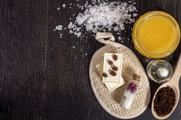 cosmetics for spa on dark background top view