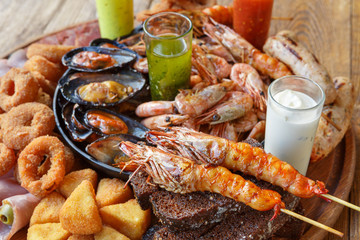 Seafood platter on wooden table background