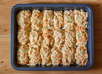 Raw lazy cabbage rolls in pan for baking.
