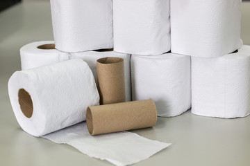 Roll of toilet paper on table.