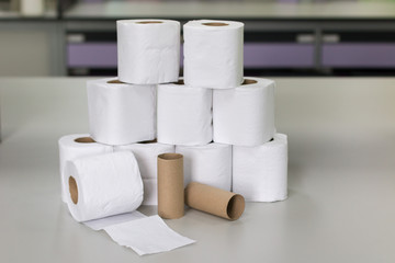 Roll of toilet paper on table.