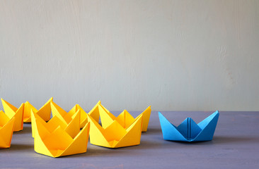 Leadership concept with paper boats