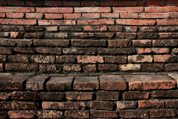 Old weathered brick wall background texture.