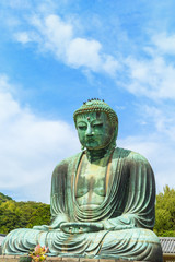 The Great Buddha in Kamakura Japan.  Located in Kamakura, Kanagawa Prefecture Japan.There are pigeon to Buddha's head.