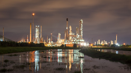 Obraz na płótnie Canvas Oil refinery plant at sunrise with sky background