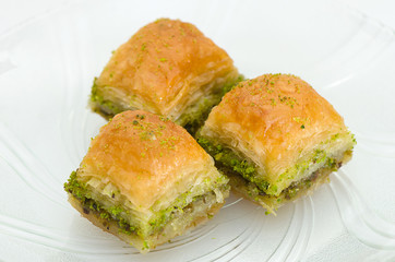 Baklava with pistachio on a white background