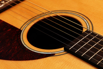 Part of a wooden acoustic guitar