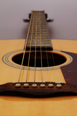 Obraz premium Part of a wooden acoustic guitar