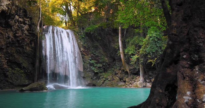 Scenic and exotic nature of tropical forest with waterfall stream HDR 4K video