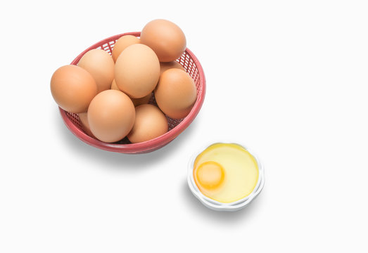 egg in basket on white background and egg in small bowl