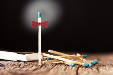 Pile of matches, wooden table black background, celebrate concept